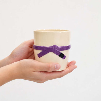 Bazilian Jiu Jitsu Cup with purple belt